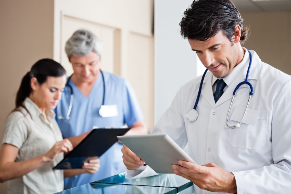 doctors looking at ipad