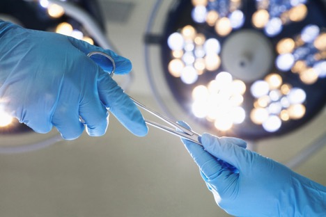 surgical assistants passing tools